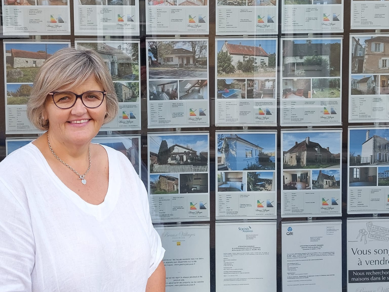 Laura Kennell standing outside the Agence le Prince Noir agency in Chaillac